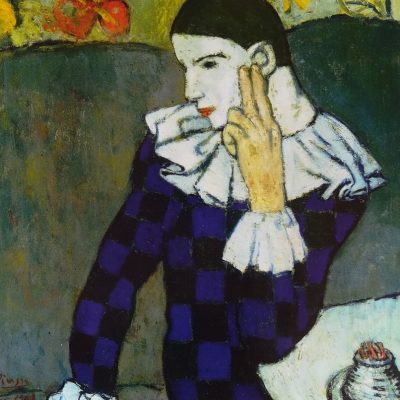 Arlequin sentado